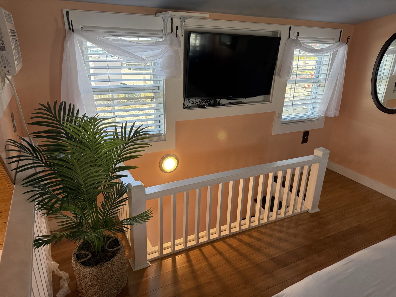 Upper loft landing with a smart TV